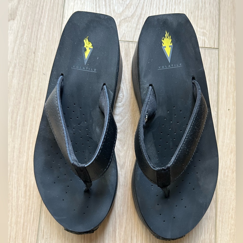 LIKE NEW! Volatile wedge flip flops. Only worn once. Heel is almost 3 inches.